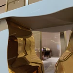 Sculptural White Console Table with Fluid Cutout and Polished Gold Interior Core
